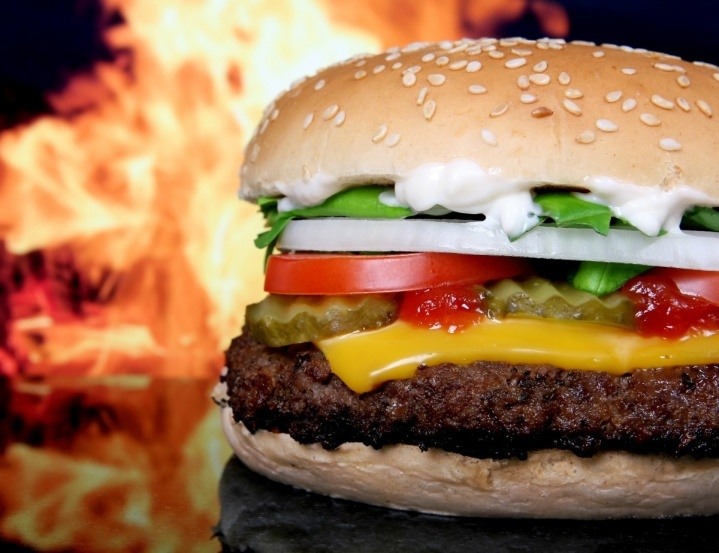 burger against fire background